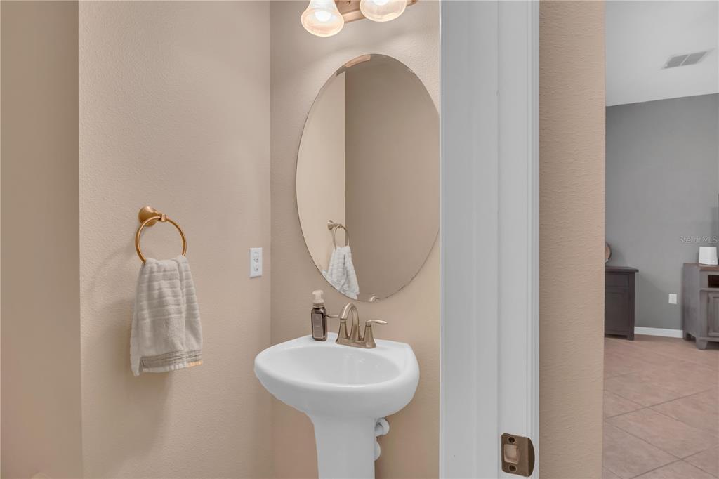 306 Reed Grass Drive Oviedo, FL 32765 - Photo 10 of 33 a bathroom with a sink and a mirror