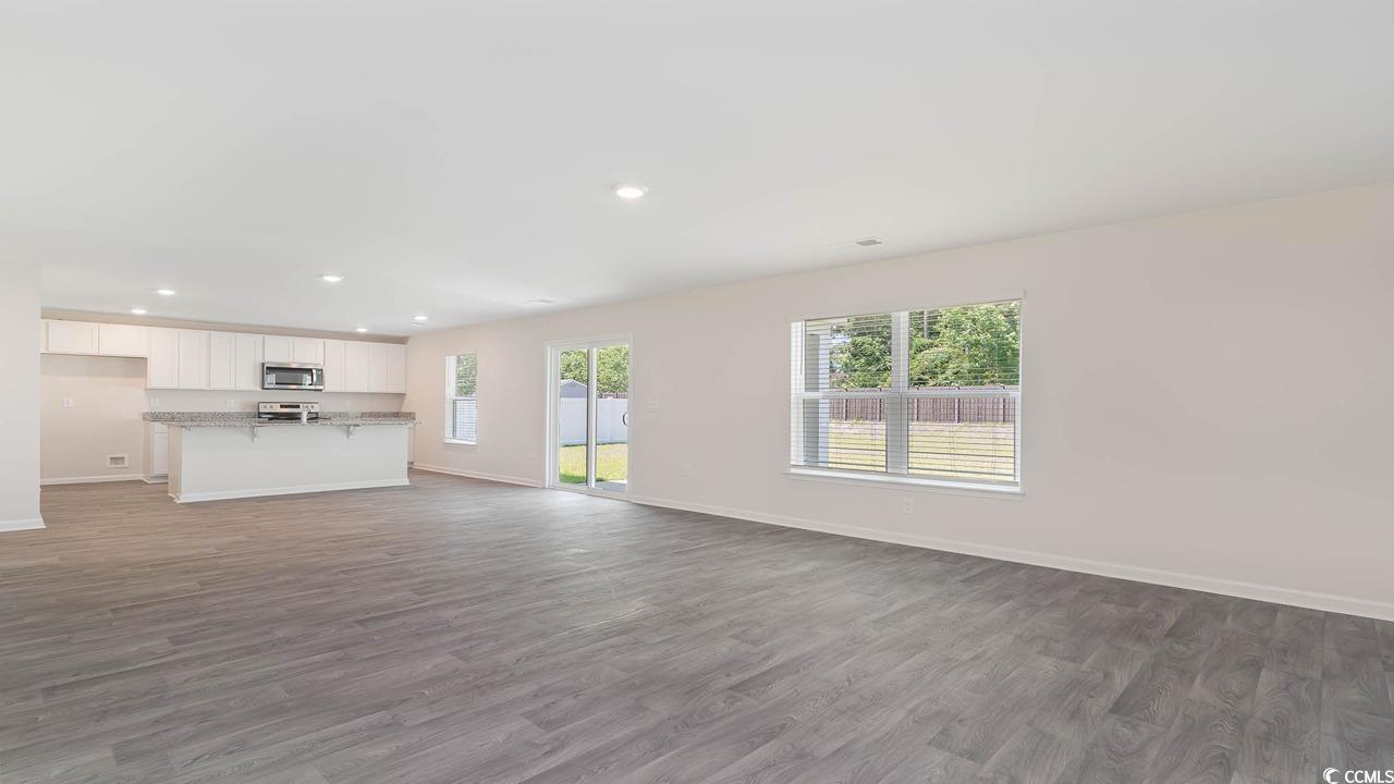 322 Acosta Circle Conway, SC 29527 - Photo 13 of 27 Unfurnished living room with dark hardwood / wood-