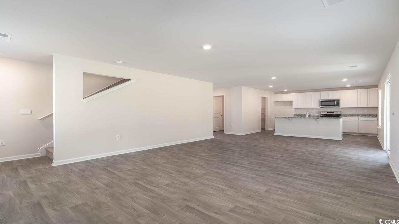 322 Acosta Circle Conway, SC 29527 - Photo 14 of 27 Unfurnished living room featuring hardwood / wood-