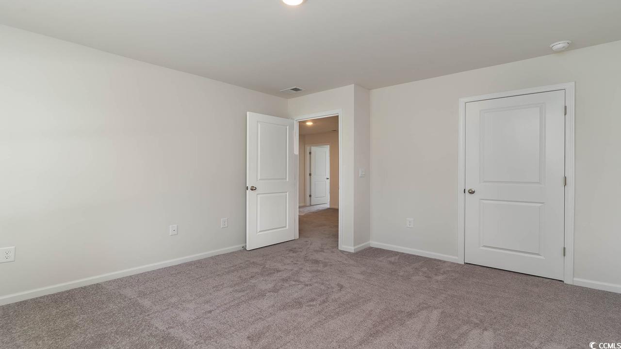 322 Acosta Circle Conway, SC 29527 - Photo 22 of 27 Spare room with light colored carpet