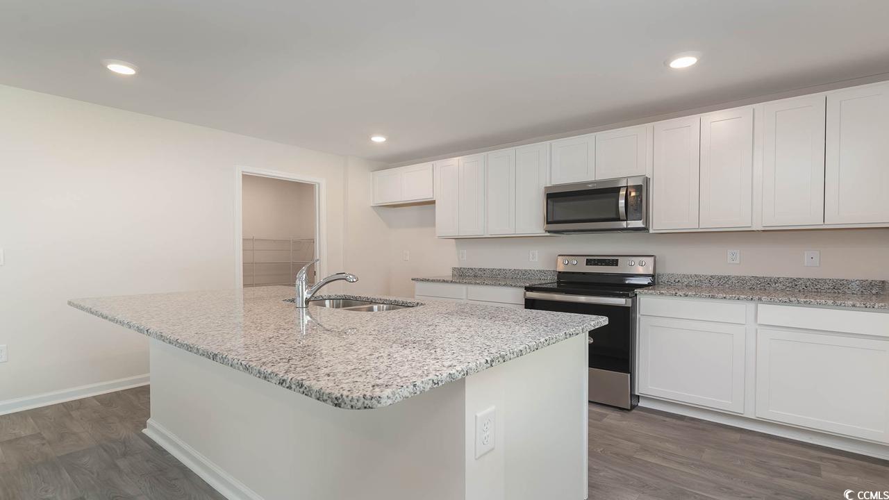 322 Acosta Circle Conway, SC 29527 - Photo 7 of 27 Kitchen featuring an island with sink, stainless s