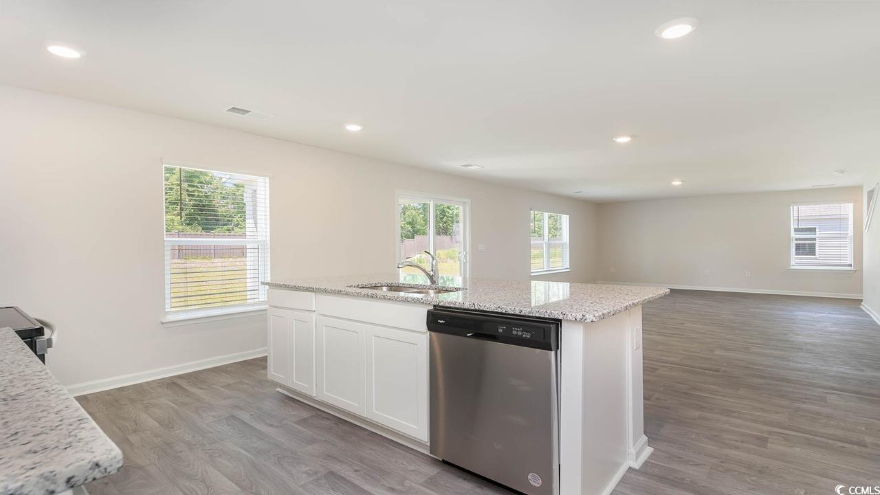 322 Acosta Circle Conway, SC 29527 - Photo 9 of 27 Kitchen with an island with sink, sink, white cabi