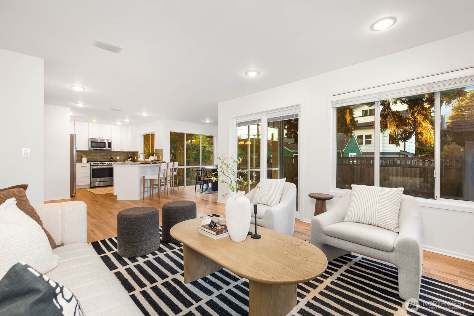 4922 Southwest Hudson Street Seattle, WA 98116 - Photo 18 of 37 a living room with furniture and large windows