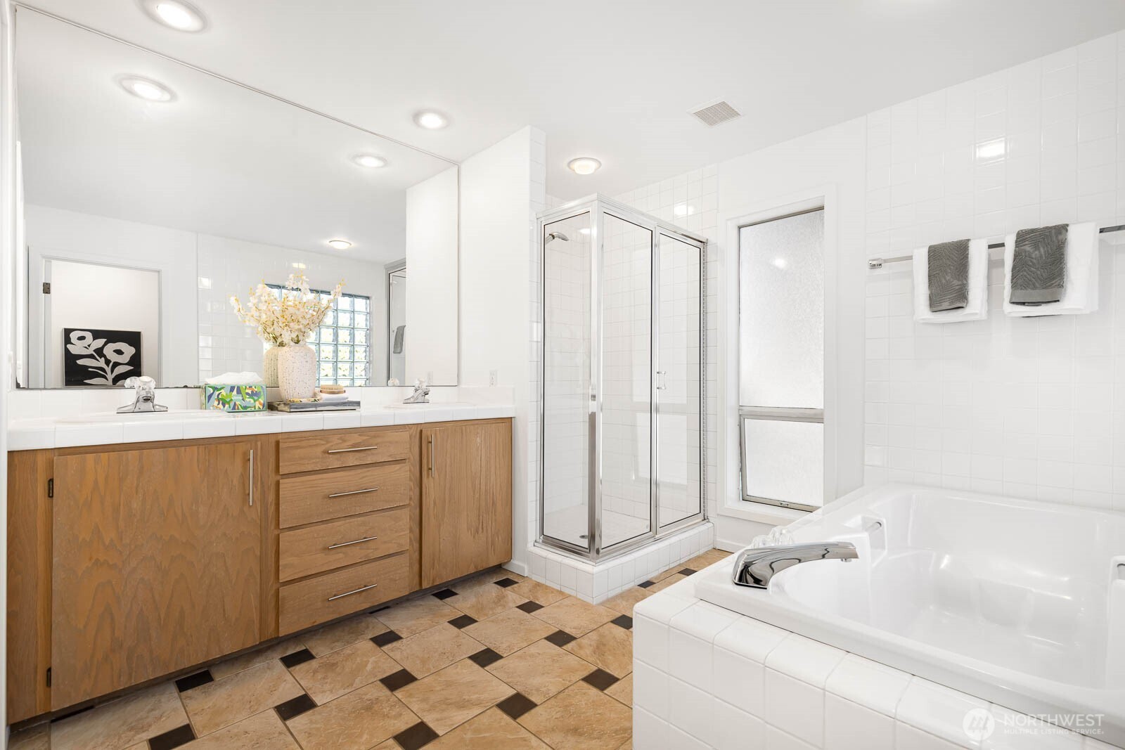 4922 Southwest Hudson Street Seattle, WA 98116 - Photo 23 of 37 a bathroom with a bathtub sink and mirror
