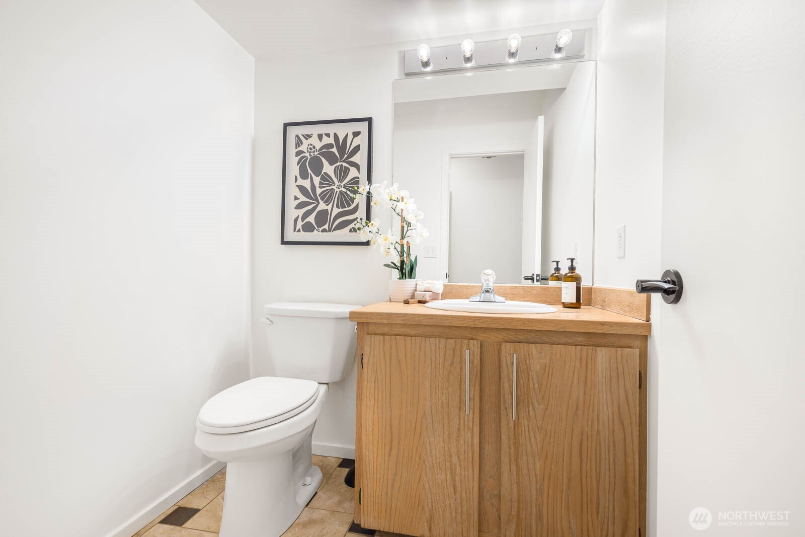 4922 Southwest Hudson Street Seattle, WA 98116 - Photo 28 of 37 a bathroom with a toilet a sink and mirror