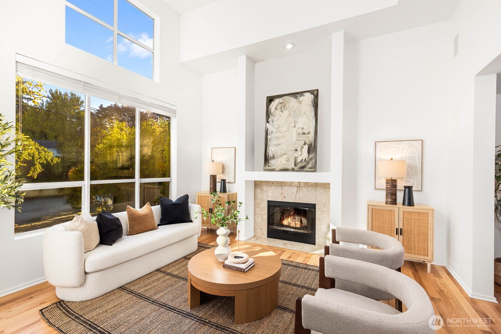 4922 Southwest Hudson Street Seattle, WA 98116 - Photo 4 of 37 a living room with furniture and a fireplace