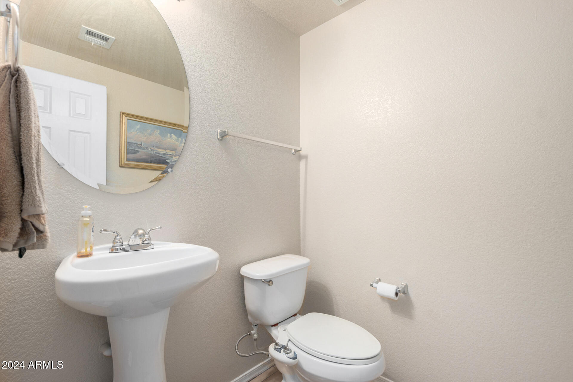 18250 North Cave Creek Road, Unit 163 Phoenix, AZ 85032 - Photo 12 of 32 a bathroom with a toilet sink and mirror