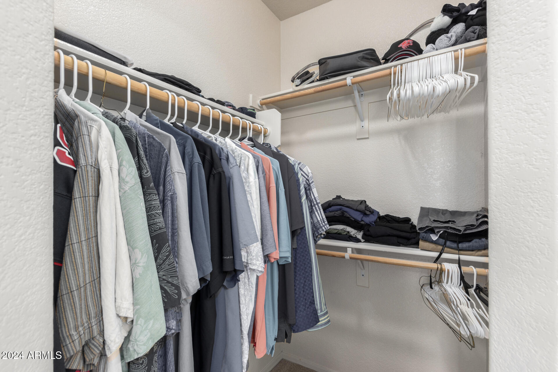 18250 North Cave Creek Road, Unit 163 Phoenix, AZ 85032 - Photo 16 of 32 a view of walk in closet with clothes and shoes
