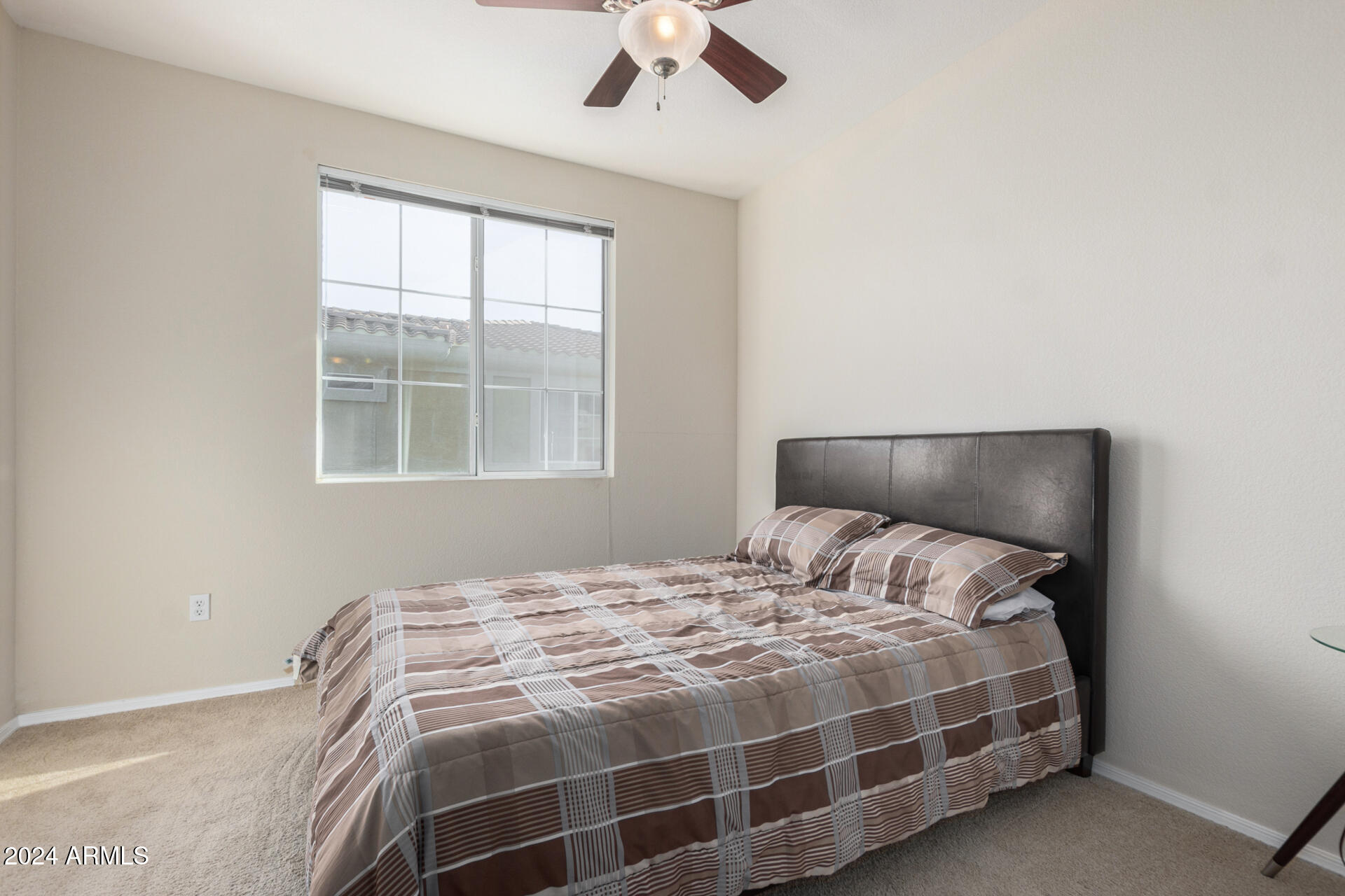 18250 North Cave Creek Road, Unit 163 Phoenix, AZ 85032 - Photo 17 of 32 a bedroom with a bed and a window