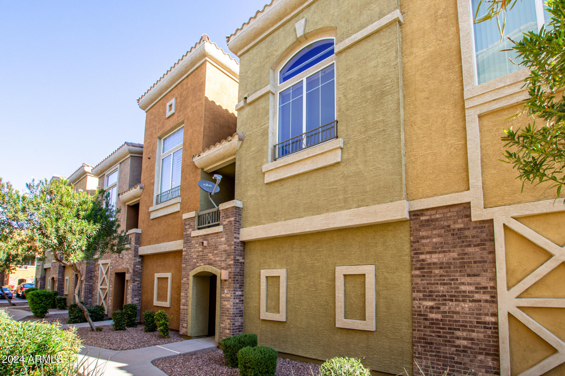 18250 North Cave Creek Road, Unit 163 Phoenix, AZ 85032 - Photo 2 of 32 a front view of a multi story residential apartment building