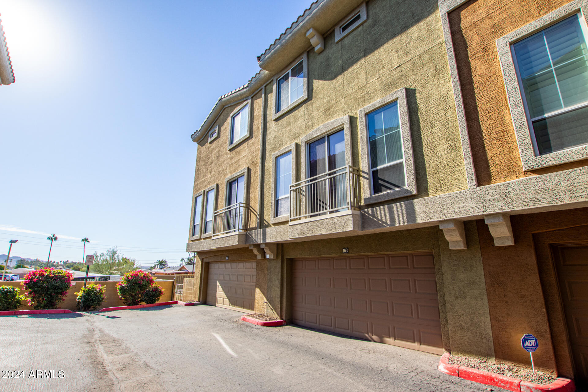 18250 North Cave Creek Road, Unit 163 Phoenix, AZ 85032 - Photo 28 of 32 a view of a building with many windows