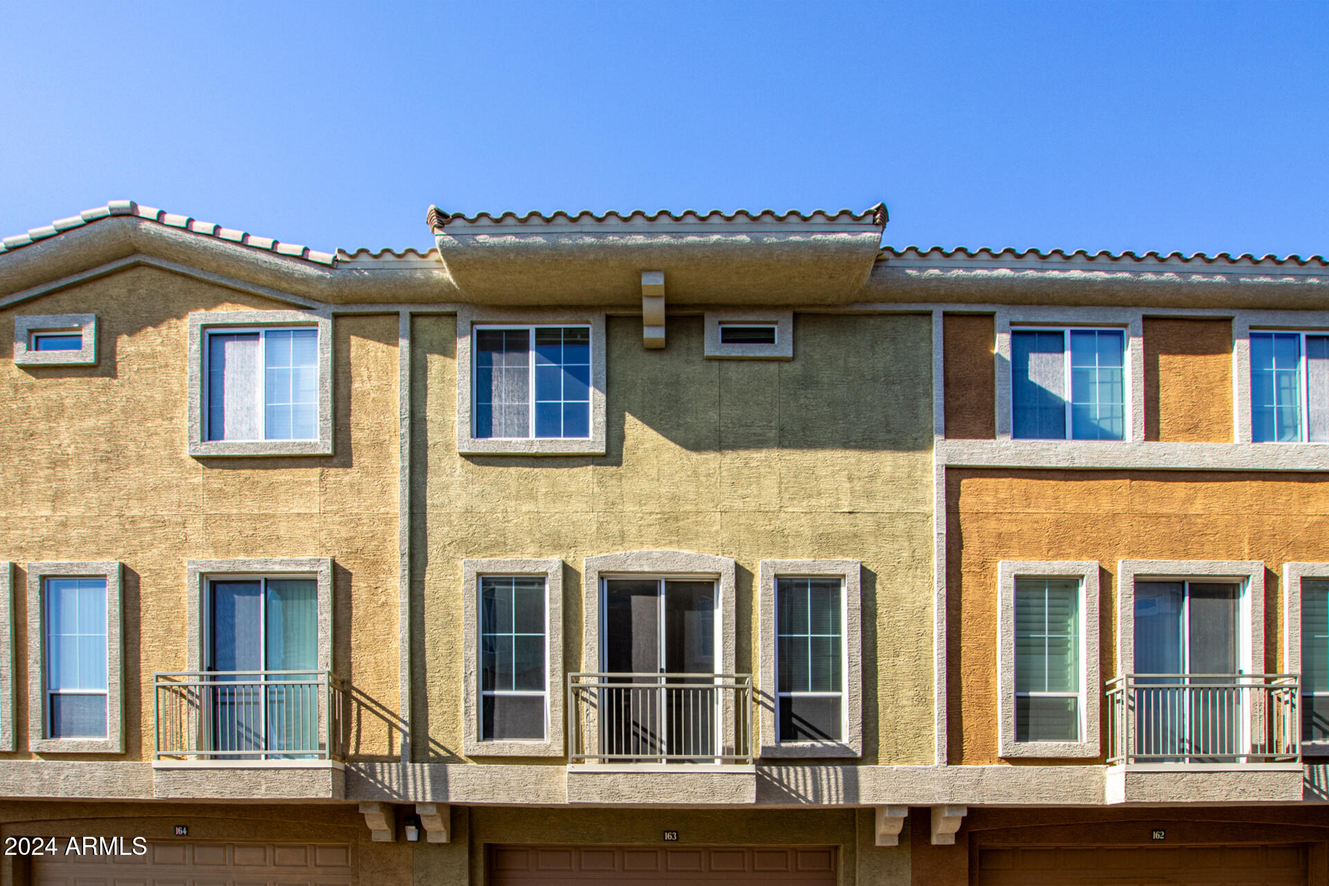 18250 North Cave Creek Road, Unit 163 Phoenix, AZ 85032 - Photo 29 of 32 a front view of a residential apartment building