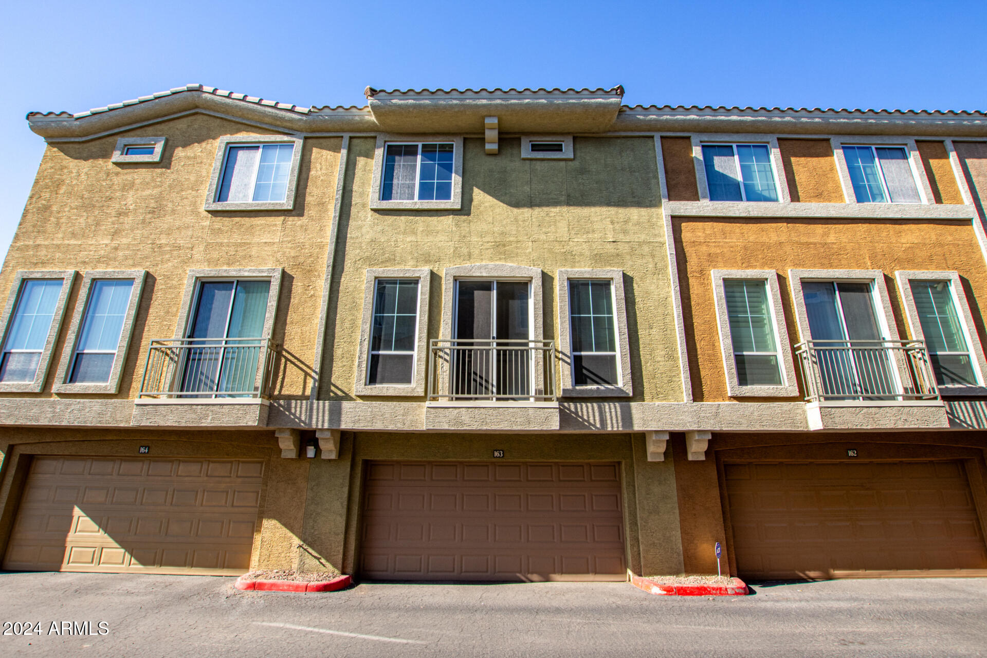 18250 North Cave Creek Road, Unit 163 Phoenix, AZ 85032 - Photo 30 of 32 a front view of residential houses