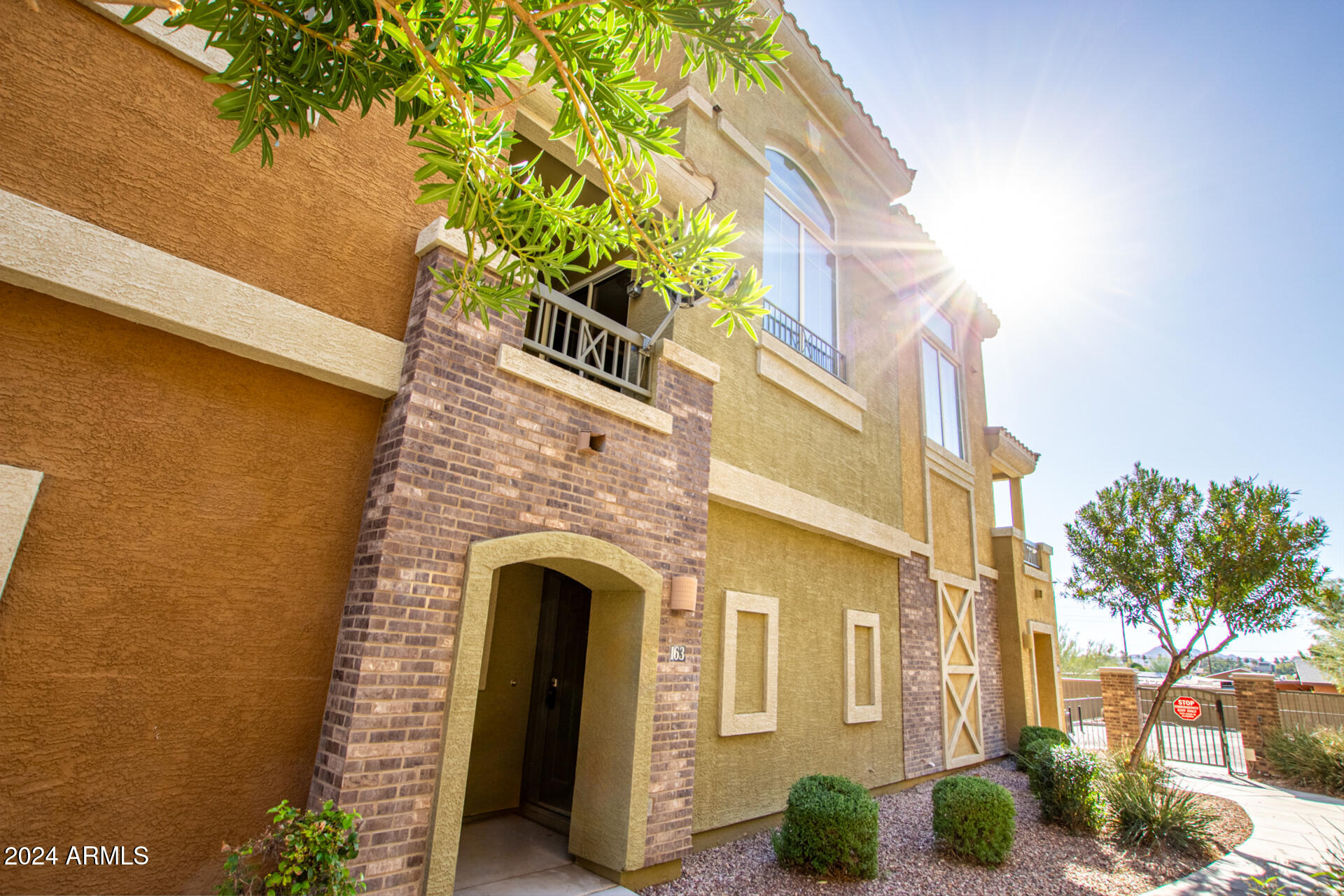 18250 North Cave Creek Road, Unit 163 Phoenix, AZ 85032 - Photo 3 of 32 a front view of a house with plants