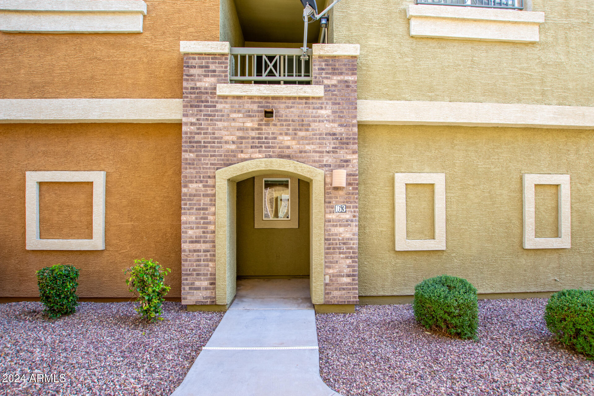 18250 North Cave Creek Road, Unit 163 Phoenix, AZ 85032 - Photo 4 of 32 a front view of a house with garden