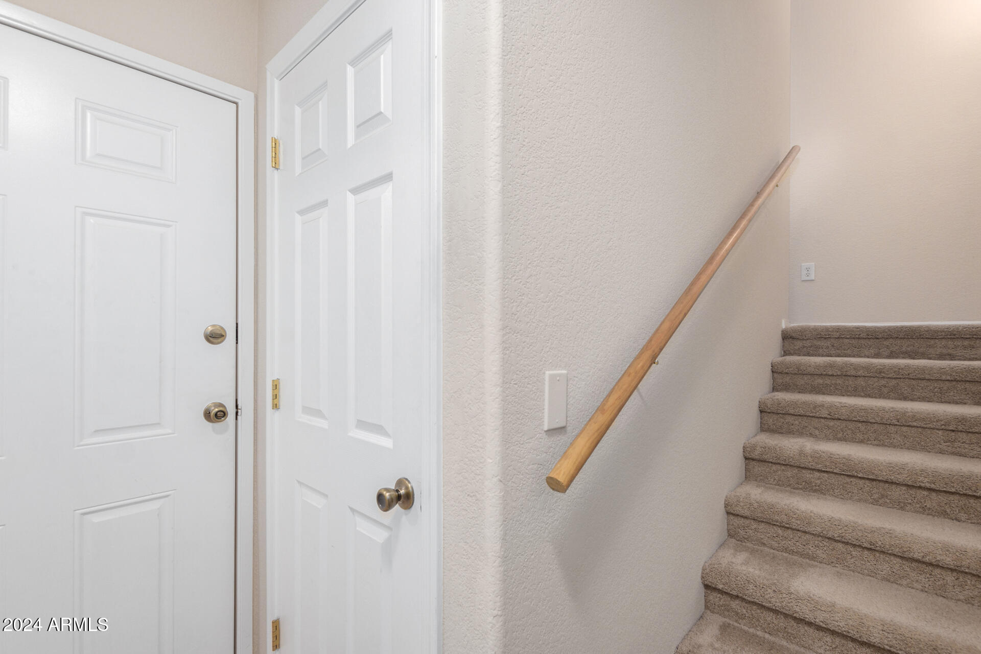 18250 North Cave Creek Road, Unit 163 Phoenix, AZ 85032 - Photo 5 of 32 a view of staircase with white walls and white door