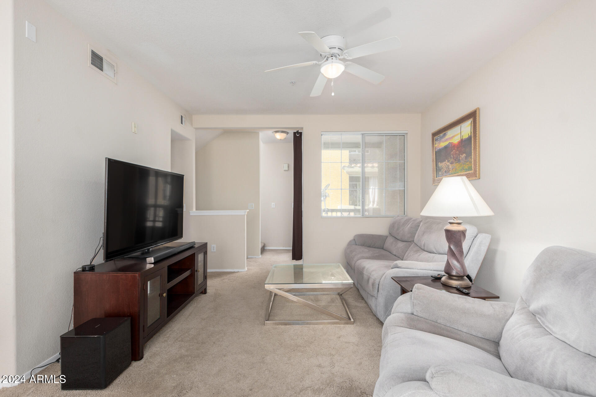 18250 North Cave Creek Road, Unit 163 Phoenix, AZ 85032 - Photo 8 of 32 a living room with furniture and a flat screen tv