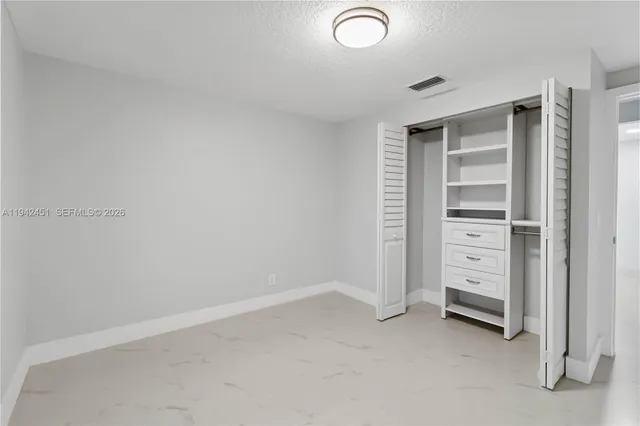 a view of an empty walk in closet
