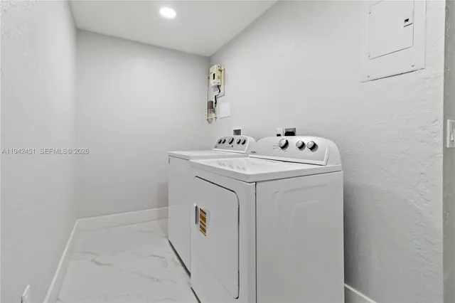 a utility room with dryer and washer
