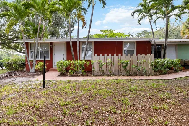 a house with trees in the background