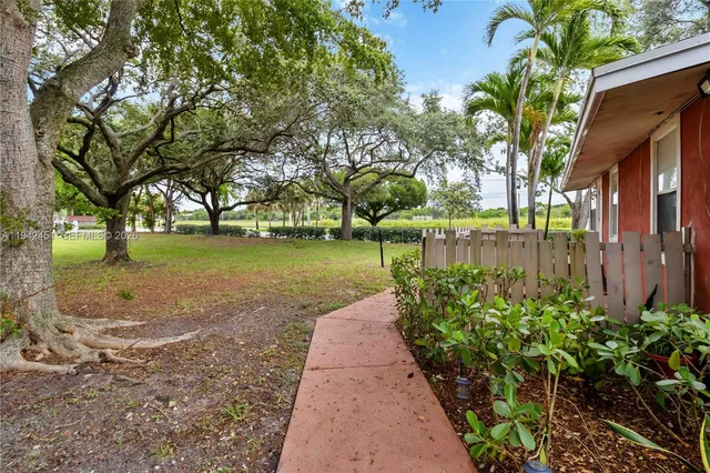 a view of a garden with a bench