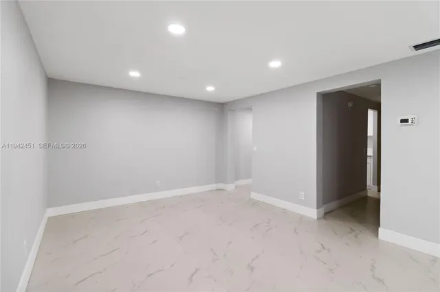 an empty room with a natural light