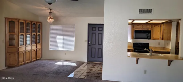 a view of kitchen and windows