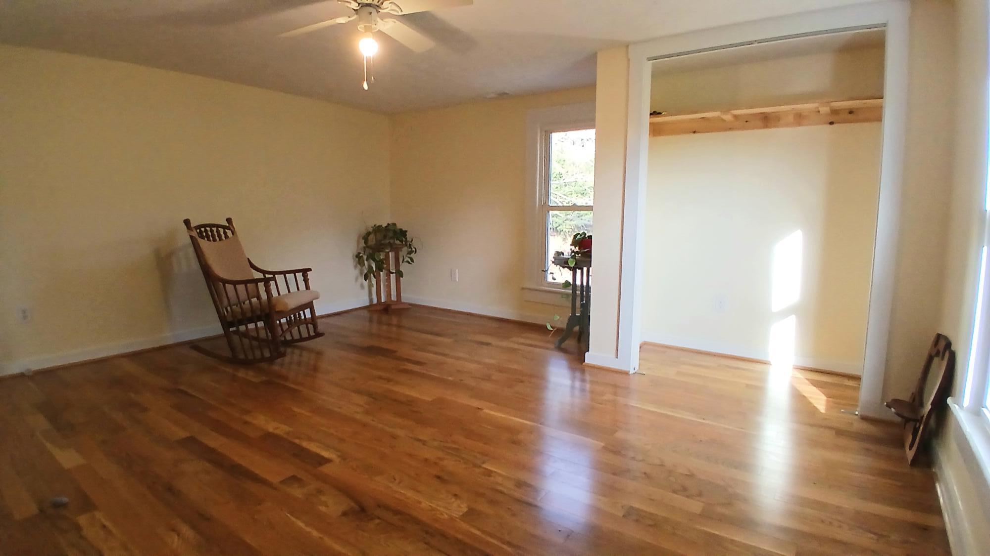 5110 Rich Patch Road Covington, VA 24426 - Photo 18 of 25 a view of an empty room with wooden floor and a glass door