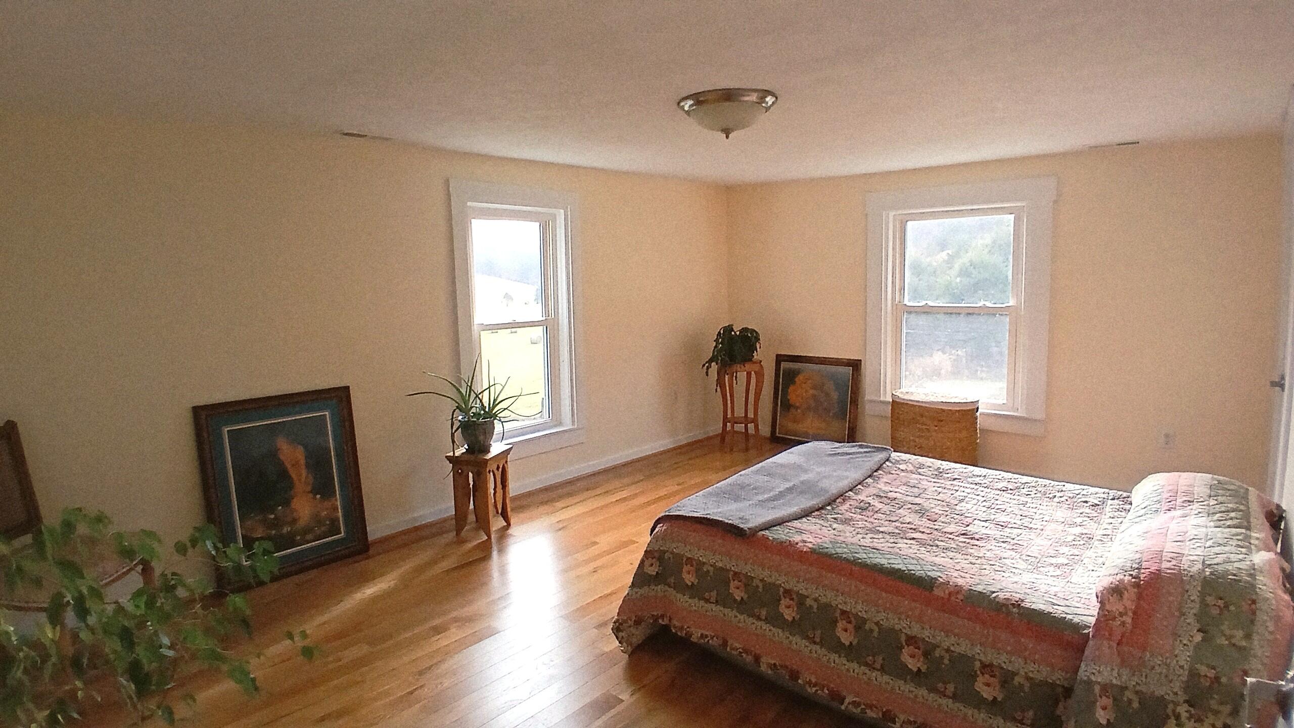 5110 Rich Patch Road Covington, VA 24426 - Photo 19 of 25 a bedroom with a bed and wooden floor