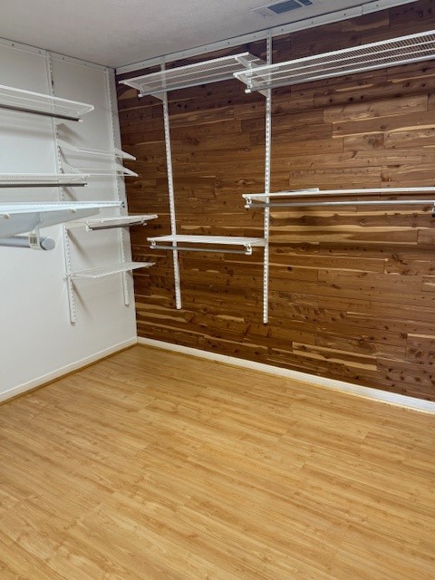 923 West 41st Street Houston, TX 77018 - Photo 12 of 13 a view of an empty room with wooden floor and cabinet