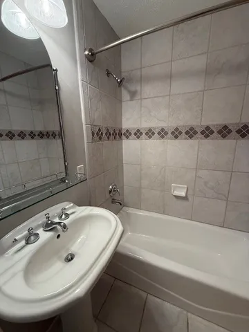 a bathroom with a sink and a bathtub