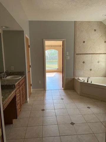 a kitchen with a sink a stove and a refrigerator