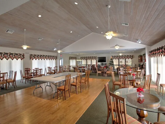 a view of a dining area with furniture window and wooden floor