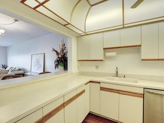 a kitchen with a sink and cabinets