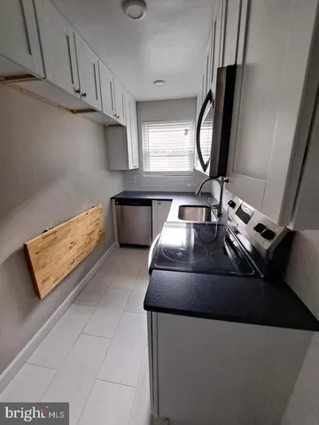 a bathroom with a sink a mirror and a bathtub