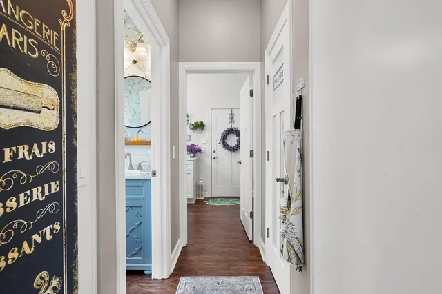 a kitchen with stainless steel appliances granite countertop a sink refrigerator and cabinets