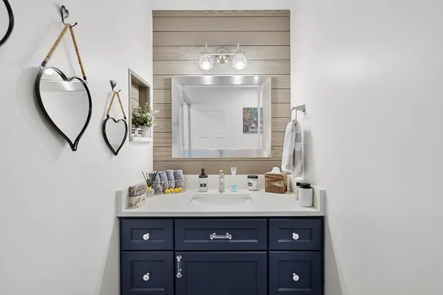 a bathroom with a sink and a mirror