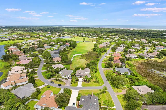 an aerial view of residential building and lake