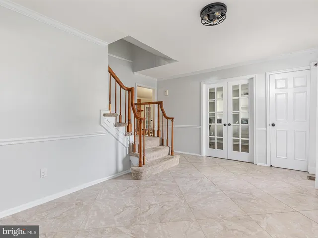 a view of an empty room with stairs