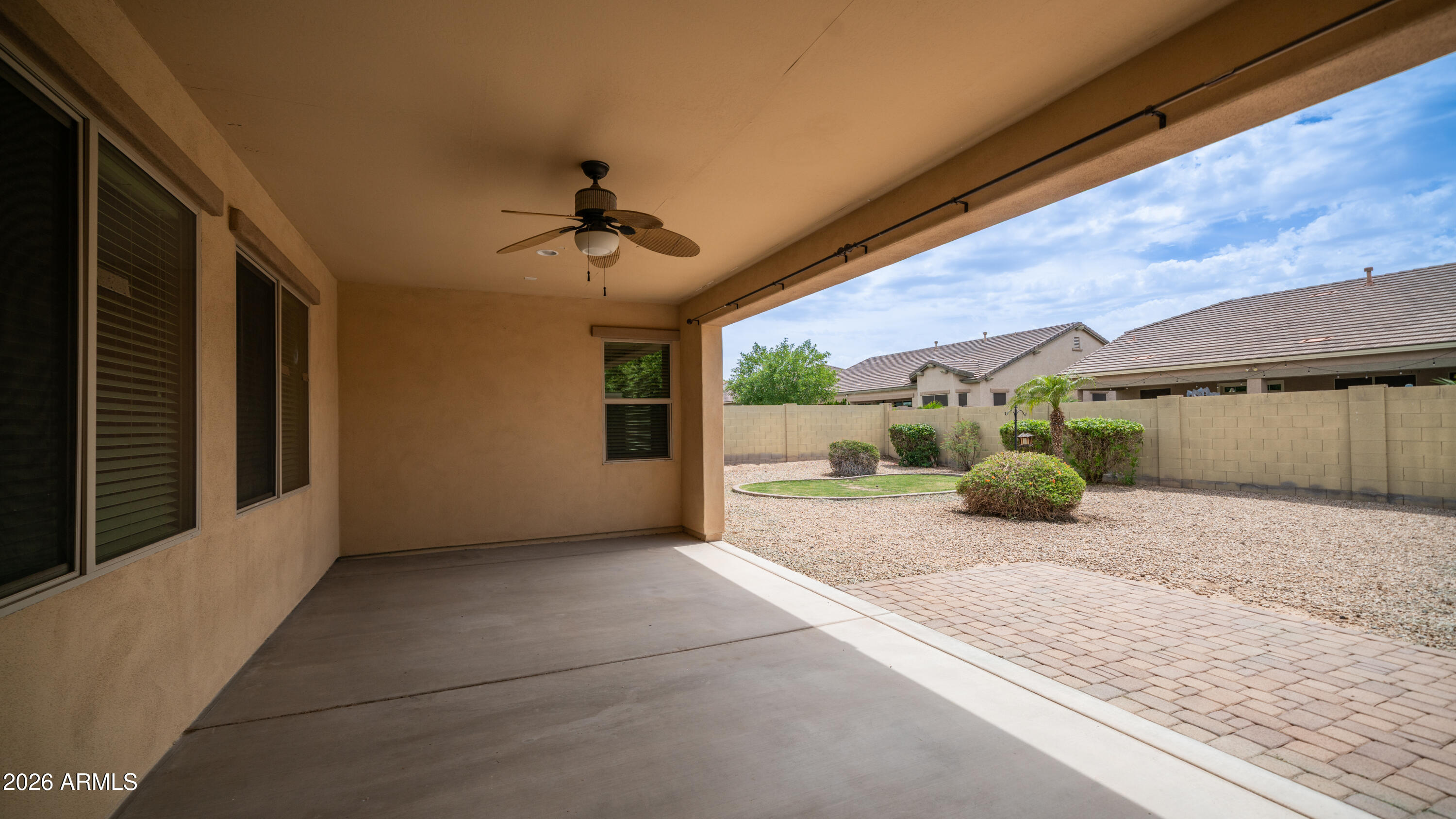 16159 West Granada Road Goodyear, AZ 85395 - Photo 35 of 41 a view of a porch with a table and chairs