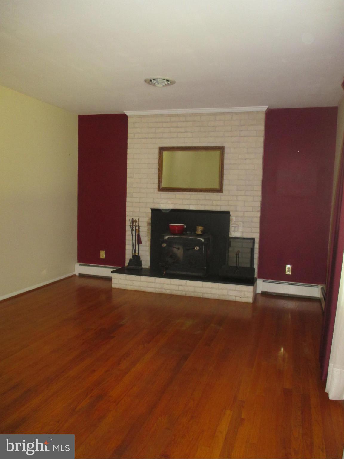 1601 Exeter Road Westminster, MD 21157 - Photo 3 of 19 a view of a livingroom with wooden floor