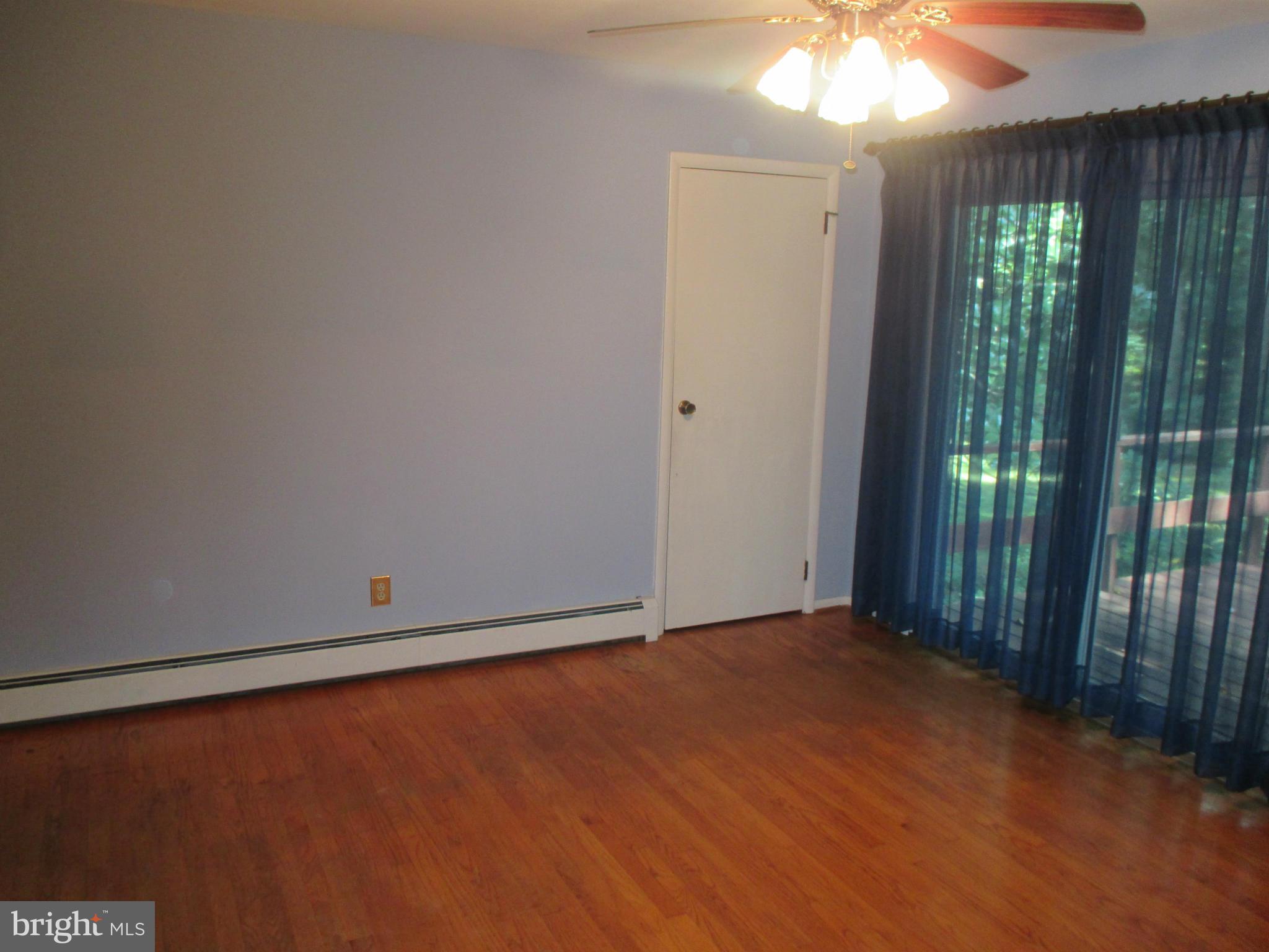 1601 Exeter Road Westminster, MD 21157 - Photo 5 of 19 an empty room with windows and outdoor view
