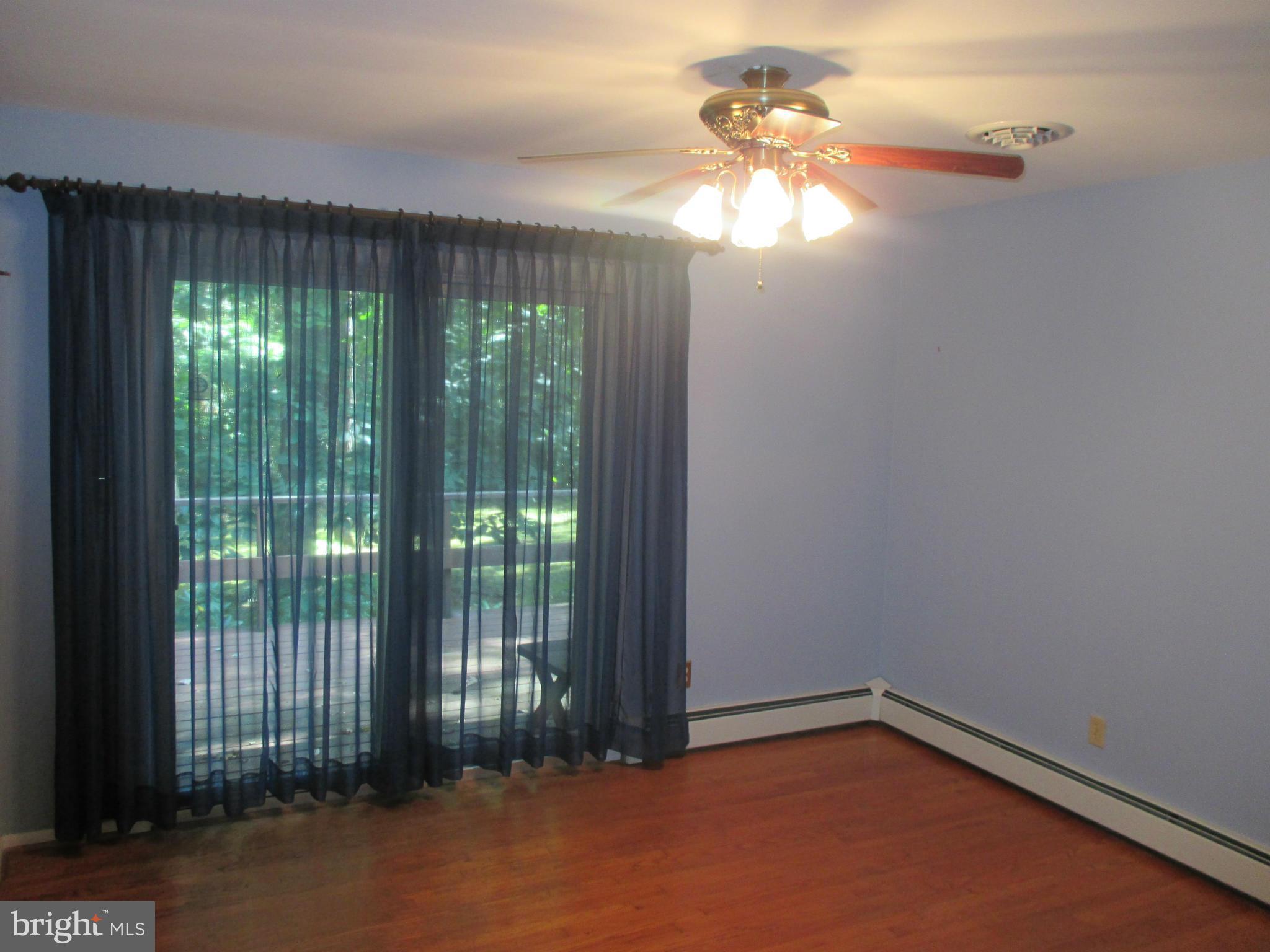 1601 Exeter Road Westminster, MD 21157 - Photo 6 of 19 a view of a livingroom with an empty space and a balcony