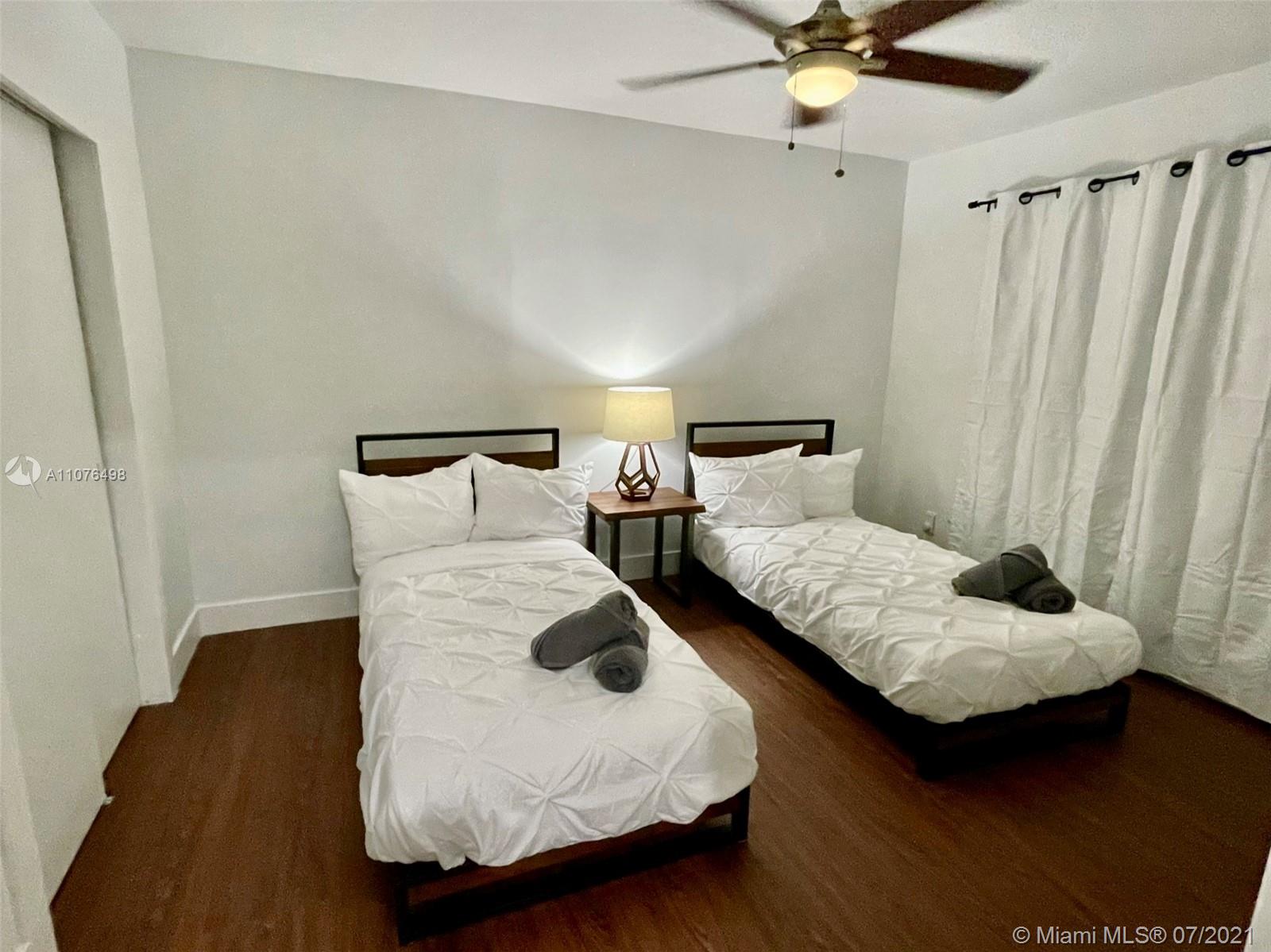 341 Southwest 21st Road Miami, FL 33129 - Photo 14 of 14 a bedroom with bed and window