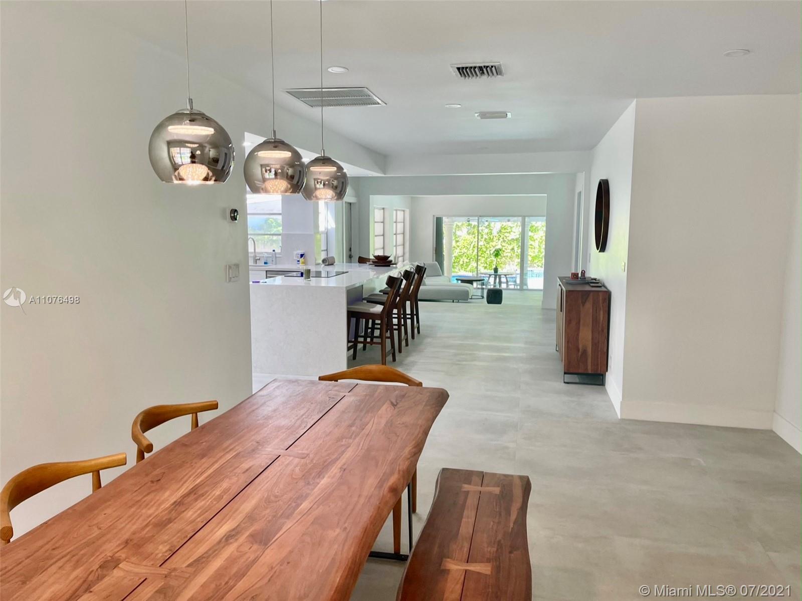 341 Southwest 21st Road Miami, FL 33129 - Photo 3 of 14 a view of a dining room with furniture and chandelier