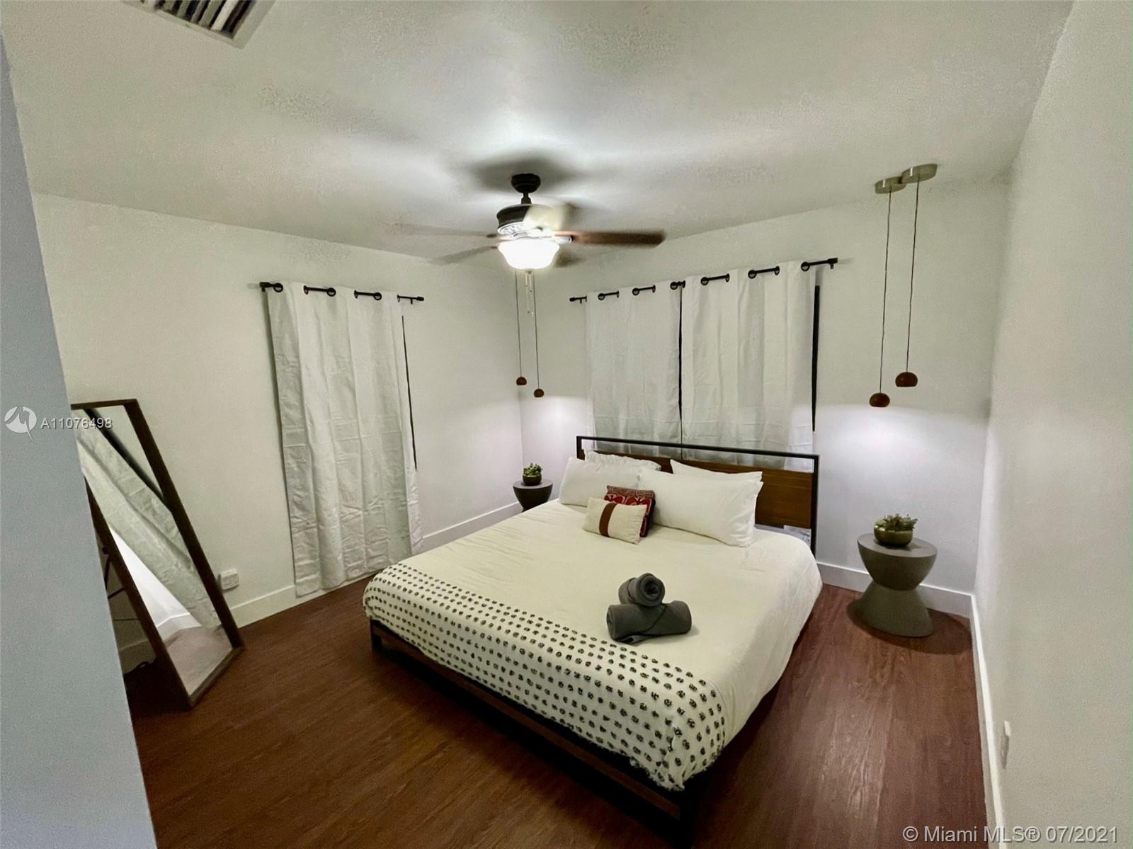 341 Southwest 21st Road Miami, FL 33129 - Photo 8 of 14 a living room with furniture and a window