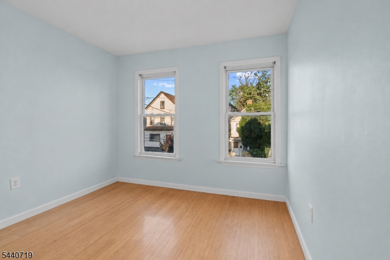 136 Smith Street Elizabeth, NJ 07201 - Photo 22 of 38 an empty room with windows