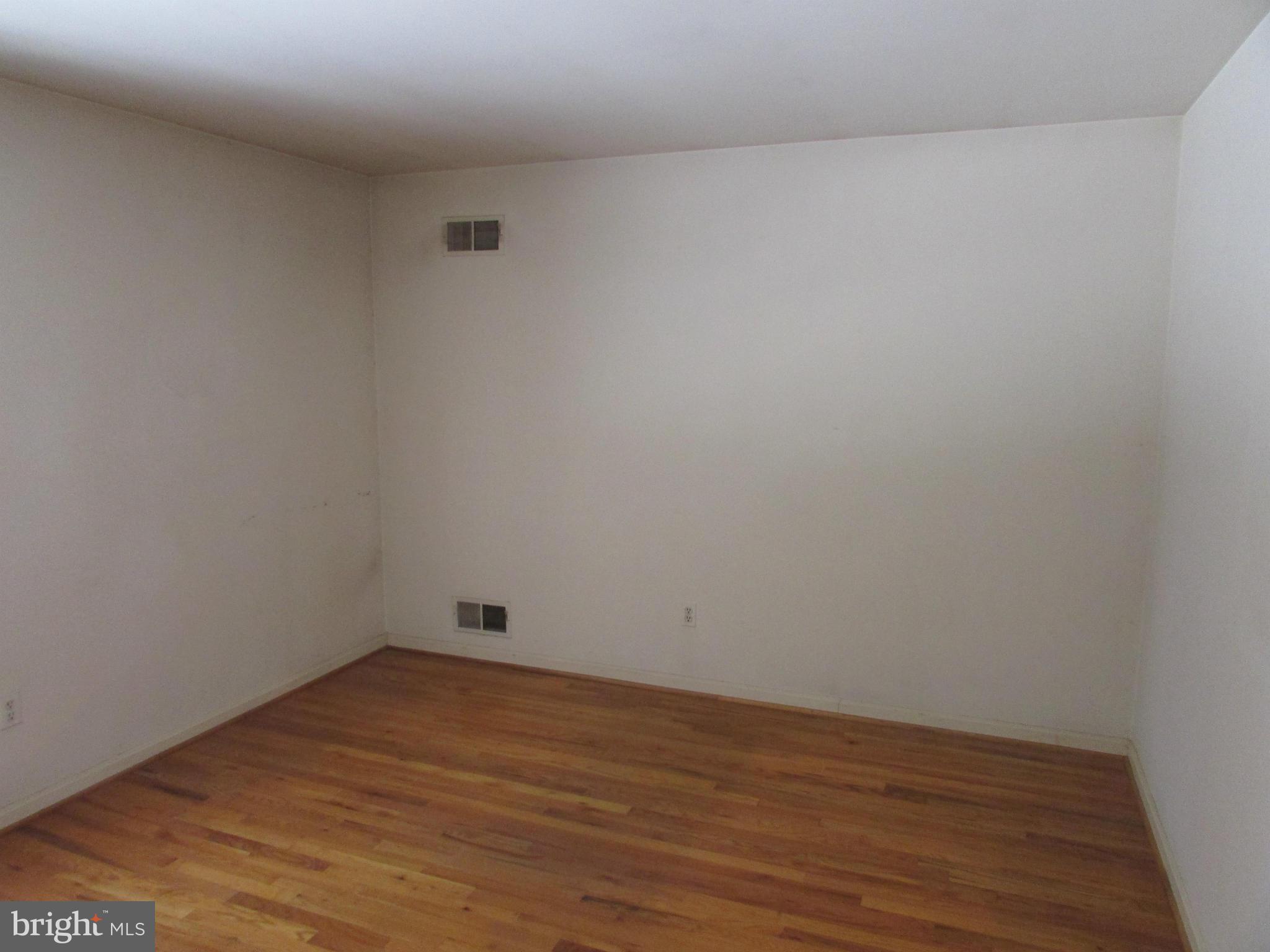 14221 Cantrell Road Silver Spring, MD 20905 - Photo 14 of 16 a view of empty room with wooden floor