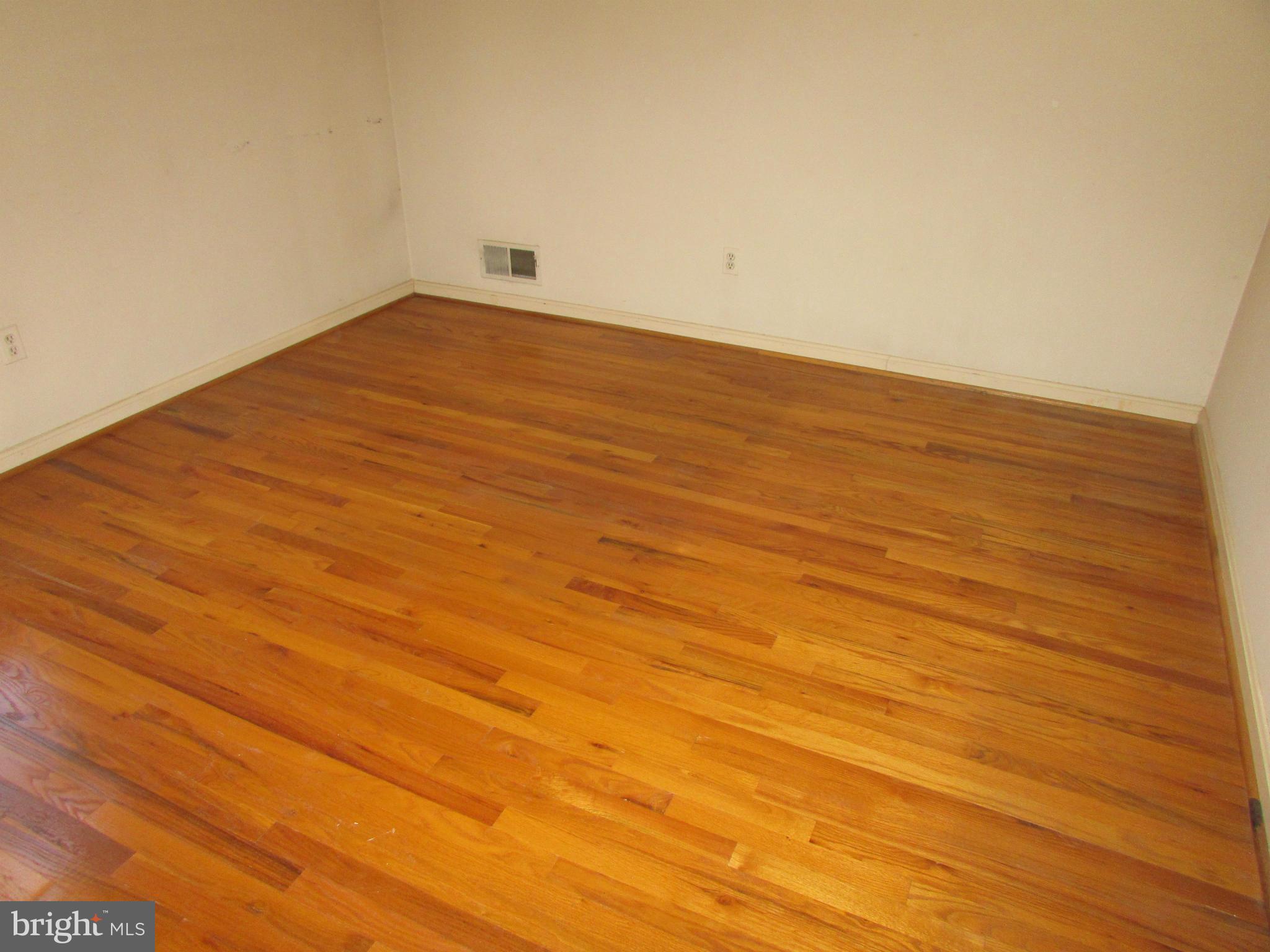 14221 Cantrell Road Silver Spring, MD 20905 - Photo 15 of 16 a view of empty room with wooden floor