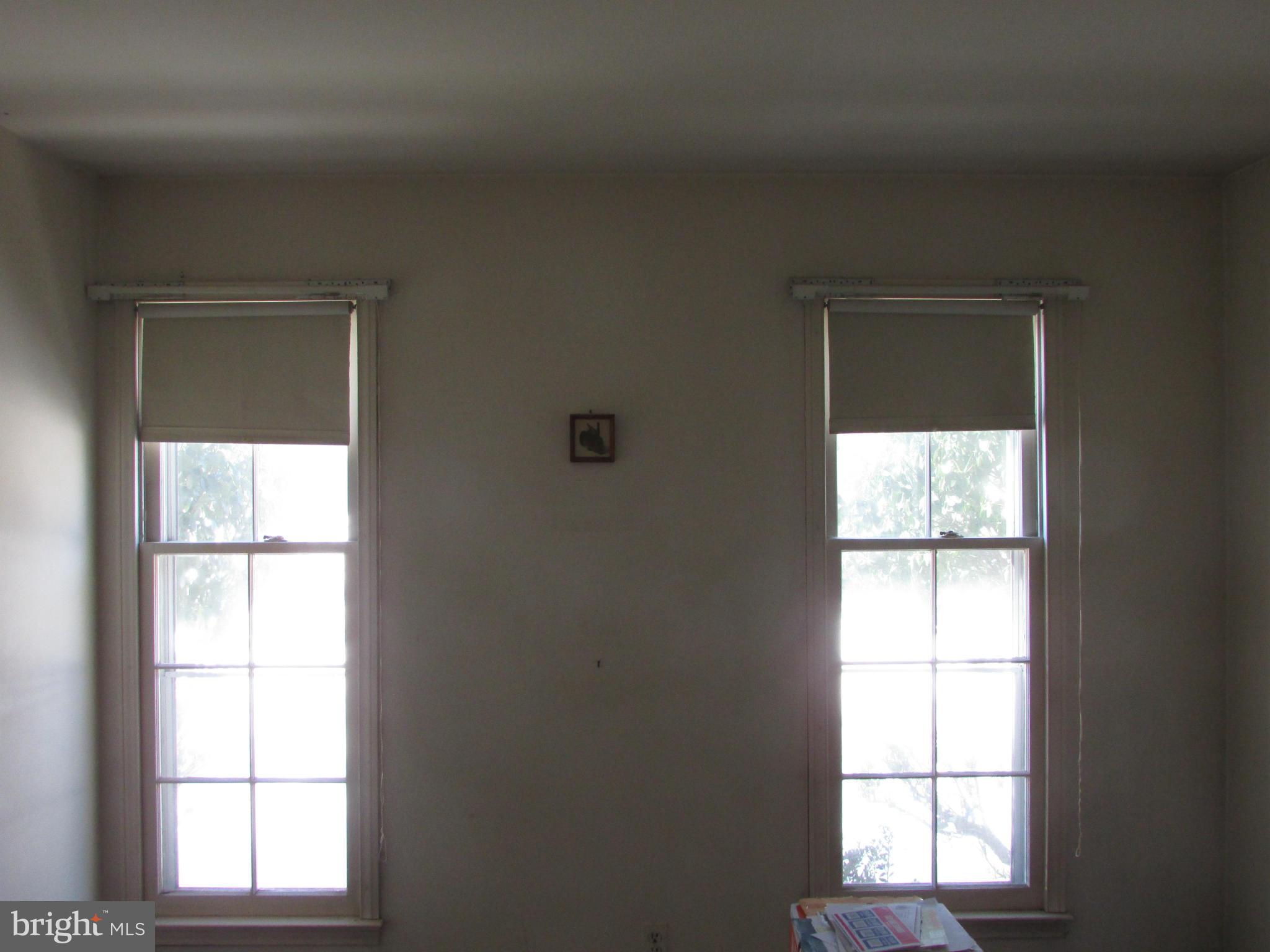 14221 Cantrell Road Silver Spring, MD 20905 - Photo 9 of 16 an empty room with a window